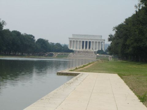 1986 Ford Bronco - The Lincoln Memorial stands beyond the reflecting pool, with trees lining the sides of the scene.