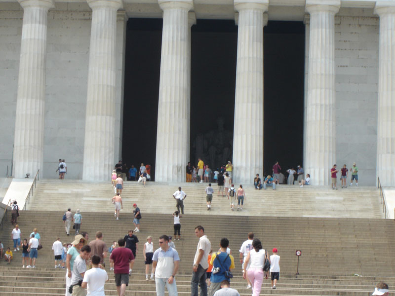 Lincoln Memorial steps with many people climbing and standing