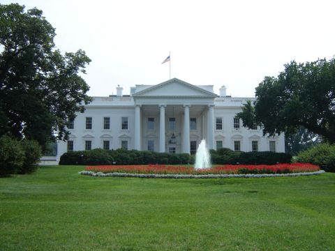 1986 Ford Bronco - The White House stands prominently with a fountain and manicured gardens.