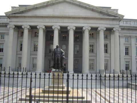 1986 Ford Bronco - The United States Treasury Department building in Washington D.C. is shown with a statue of a man in front.