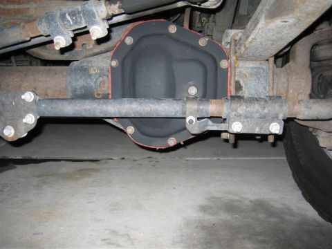 1999 Ford F-250 - Underside view of a truck's rear differential and associated suspension parts.