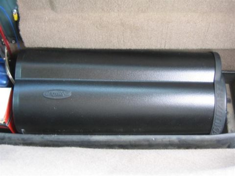 1999 Ford F-250 - A Bazooka subwoofer enclosure is visible inside a vehicle's cargo area.