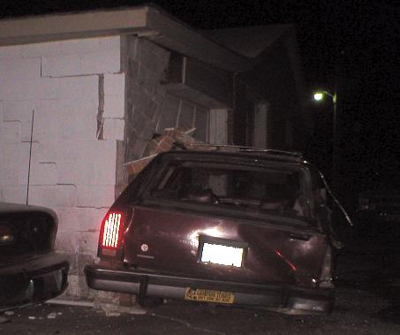 1987 Ford Crown Victoria LTD - 1987 Ford Crown Victoria LTD wagon rear end damaged after crashing into a brick building.