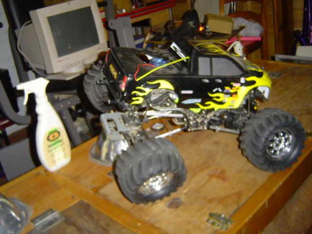 Black and yellow remote control monster truck with large tires