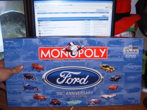 1988 Ford Bronco - Ford Monopoly 100th Anniversary Collector's Edition board game box shows historical Ford vehicles.