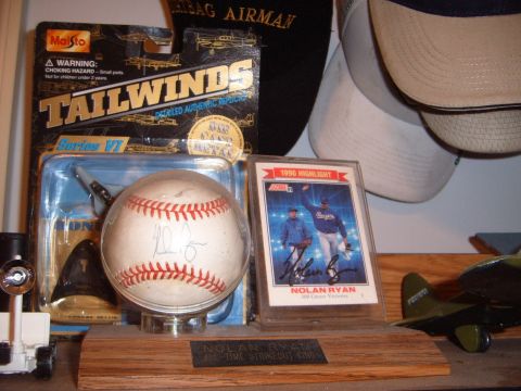 1988 Ford Bronco - A collection of baseball memorabilia and a model airplane are displayed on a shelf.