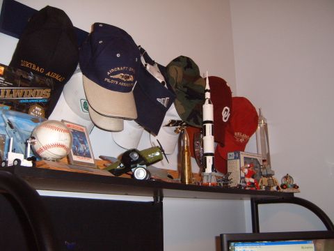 1988 Ford Bronco - A shelf displays a collection of memorabilia including sports items, models, and hats.
