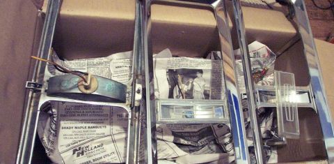 1985 Ford Crown Victoria LTD - Chrome trim pieces are stored in a box, packed with newspaper for protection.