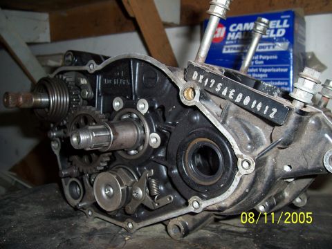 1987 Ford Bronco - Close-up of a motorcycle engine crankcase showing internal gears and shafts. Date stamp 08/11/2005.