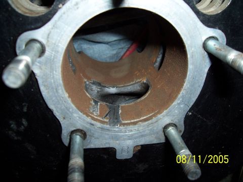 1987 Ford Bronco - Close-up of an engine cylinder showing internal wear and rust, with a date stamp visible.