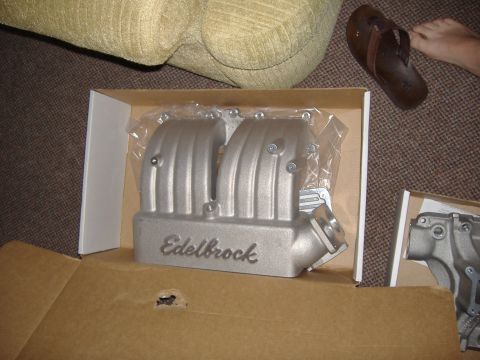1996 Ford Bronco - An Edelbrock intake manifold is shown in its packaging, with another part visible to the right.