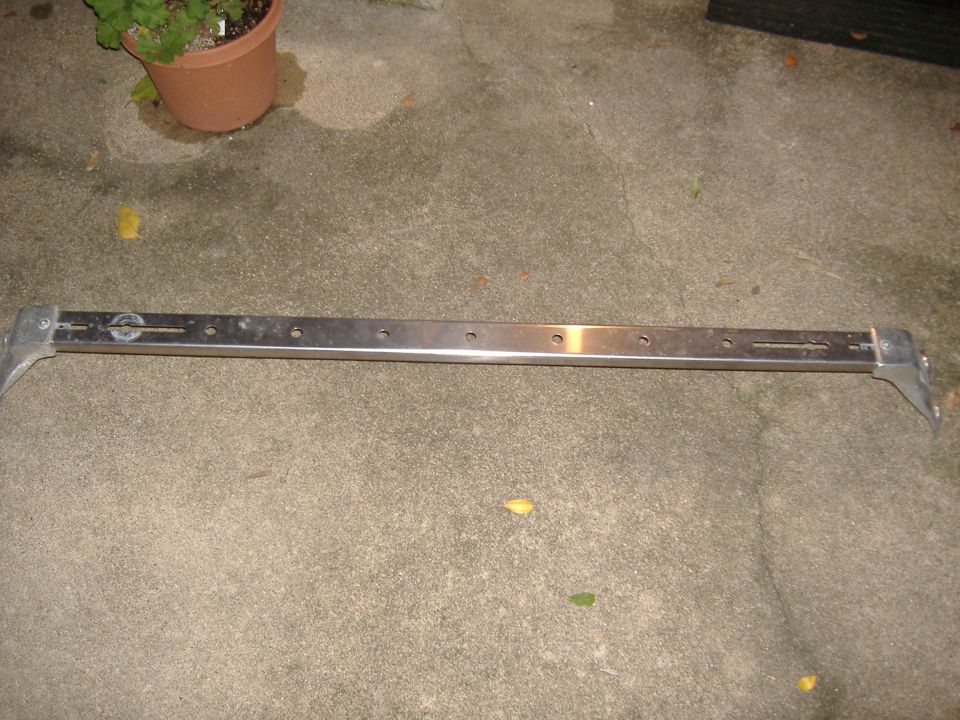 Metal bar with mounting brackets and multiple holes