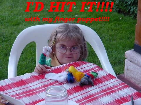 1989 Ford Bronco - A young girl with glasses and finger puppets on her fingers sits at a table covered with a red and white checkered cloth.