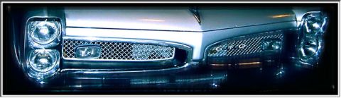 1967 Pontiac GTO - Front view of a 1967 Pontiac GTO, highlighting its distinctive grille and dual headlights.