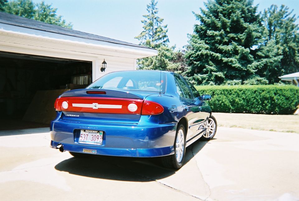 Blue sedan rear view with license plate 537 3093