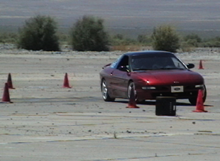 1996 Ford Probe on a track with orange cones around it