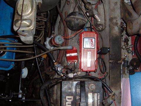 1978 Ford Bronco - Engine bay details MSD ignition components and a battery.