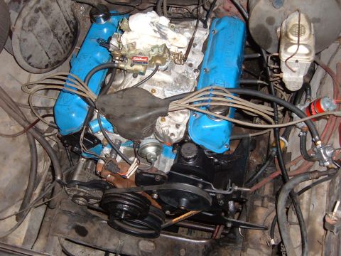 1978 Ford Bronco - Engine bay detail showing a V8 engine with blue valve covers and carburetor.