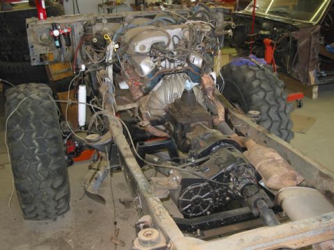 1981 Ford Bronco - This vehicle's chassis, engine, and drivetrain are exposed in a workshop setting.