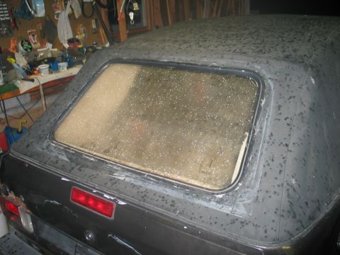 1986 Volkswagen Cabriolet - Rear view of a 1986 Volkswagen Cabriolet showing its convertible top and taillight.
