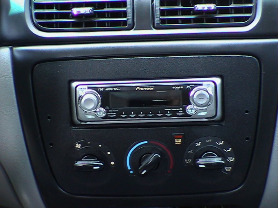 Car interior dashboard showing a Pioneer stereo and climate control knobs