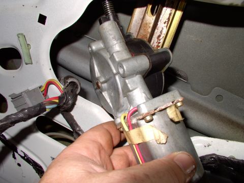 1990 Lincoln Town Car - After the three bolts are out and you've unplugged the motor, just pull the motor out far enough to get at it. This way you don't have to d…
