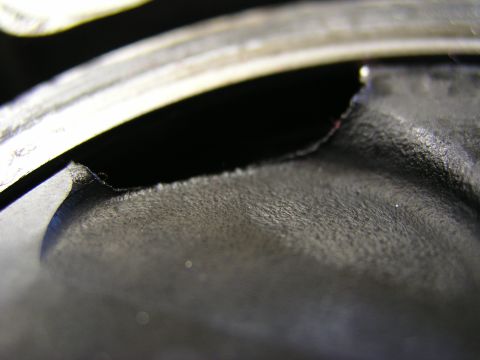 1996 Ford Probe - This piston shows significant damage, likely from engine failure during operation.