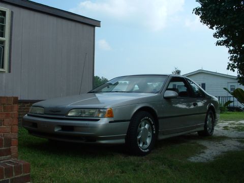 1989 Ford Thunderbird - 1989 Ford Thunderbird coupe parked outside on a cloudy day.