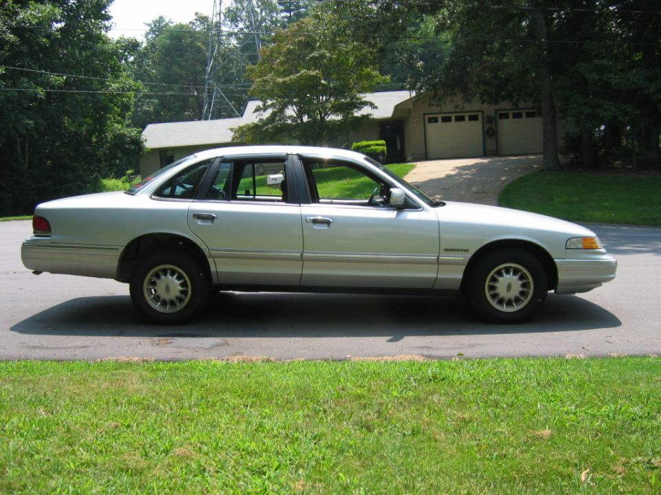 Silver sedan side view, 1995 model year