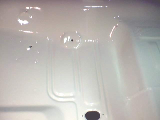 White painted floor pan with raised ribs and circular indentations