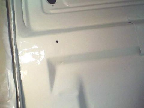 1966 Ford Fairlane - The interior floor of a vehicle, recently painted white.