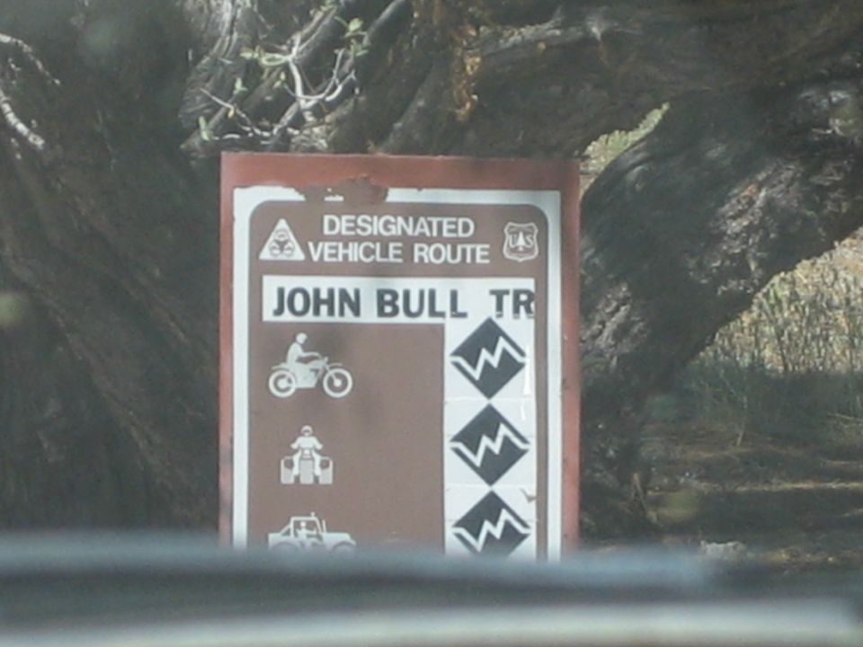 Brown Designated Vehicle Route sign reading JOHN BULL TR with difficulty icons