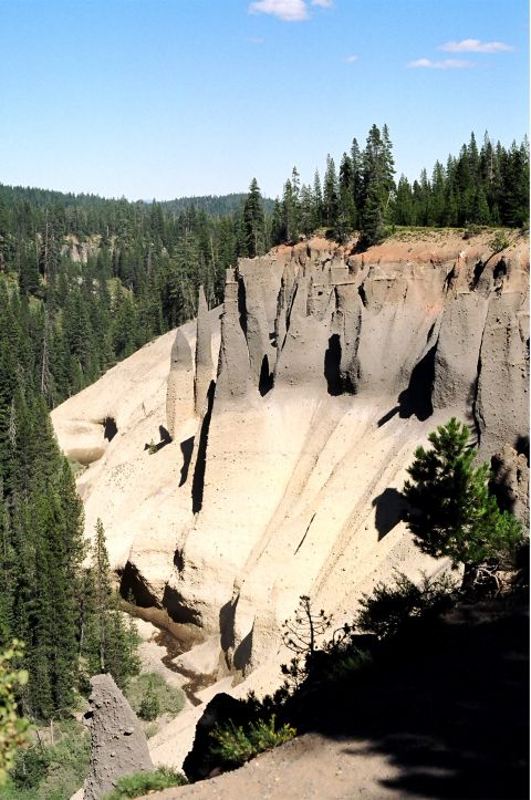 1979 Ford Bronco - Natural rock formations and evergreen trees in a mountainous landscape.