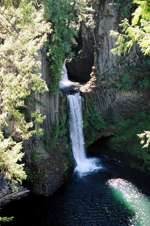 1979 Ford Bronco - A scenic view of a waterfall in a natural canyon setting, with lush greenery and water features.
