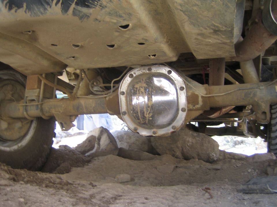 Underside view of a vehicle showing the rear differential and axle