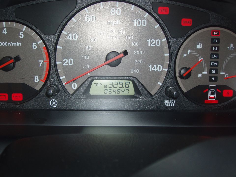 Dashboard gauges showing 54,847 miles and 329.8 trip miles
