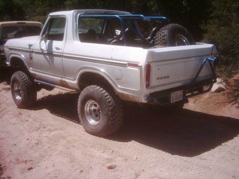 1978 Ford Bronco - This lifted 1978 Ford Bronco is ready for an adventure on a dirt road, with a spare tire mounted in the back.
