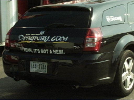 Rear of a black Dodge Magnum wagon with Dragway.com decal and HEMI window sticker