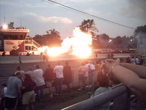 1990 Ford LTD Crown Victoria - A drag race car explodes during an event at New England Dragway.