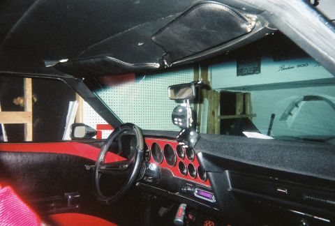 1972 Ford Ranchero - The interior of a 1972 Ford Ranchero shows its distinctive dashboard and seating, along with a hanging dice air freshener.