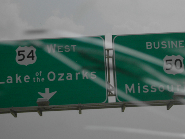 Highway signs for 54 West Lake of the Ozarks and Business 50 Missouri