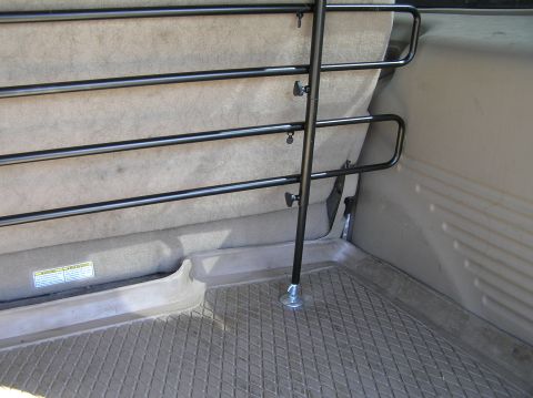 2000 Ford Excursion - Interior view of a dog barrier installed in the cargo area of a 2000 Ford Excursion.