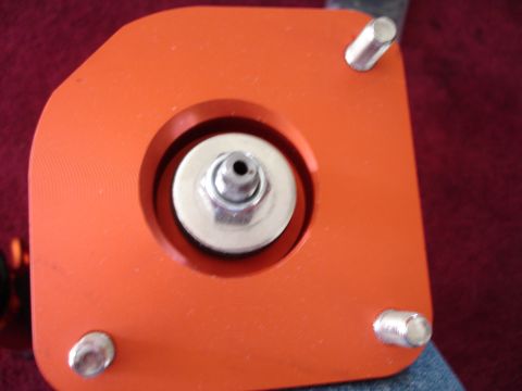 1989 Mazda MX-6 - Close-up of an adjustable strut mount, showing its construction and hardware.