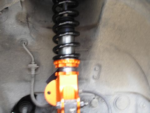 1989 Mazda MX-6 - Aftermarket coilover suspension part shown in detail.