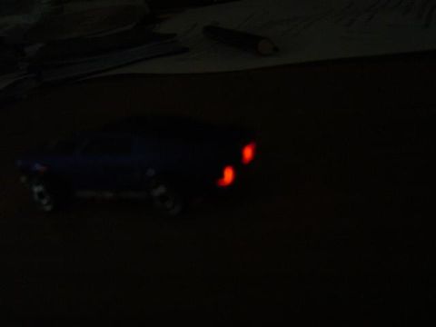 1979 Ford Bronco - Toy car with illuminated taillights, possibly a model of a 1979 Ford Bronco.