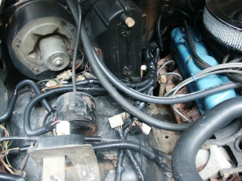 1982 Ford Bronco - Close-up view of an engine bay, showing various components and wiring harnesses.