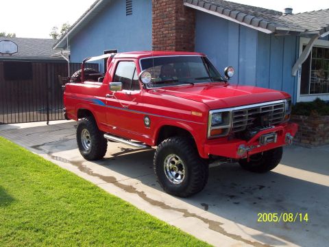 1985 Ford Bronco - This red Ford Bronco appears to be from the early 1980s, not a 1985 model.