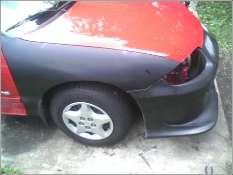 2005 Chevrolet Cavalier - This vehicle features a red body with a black fender and bumper, and a five-star wheel.