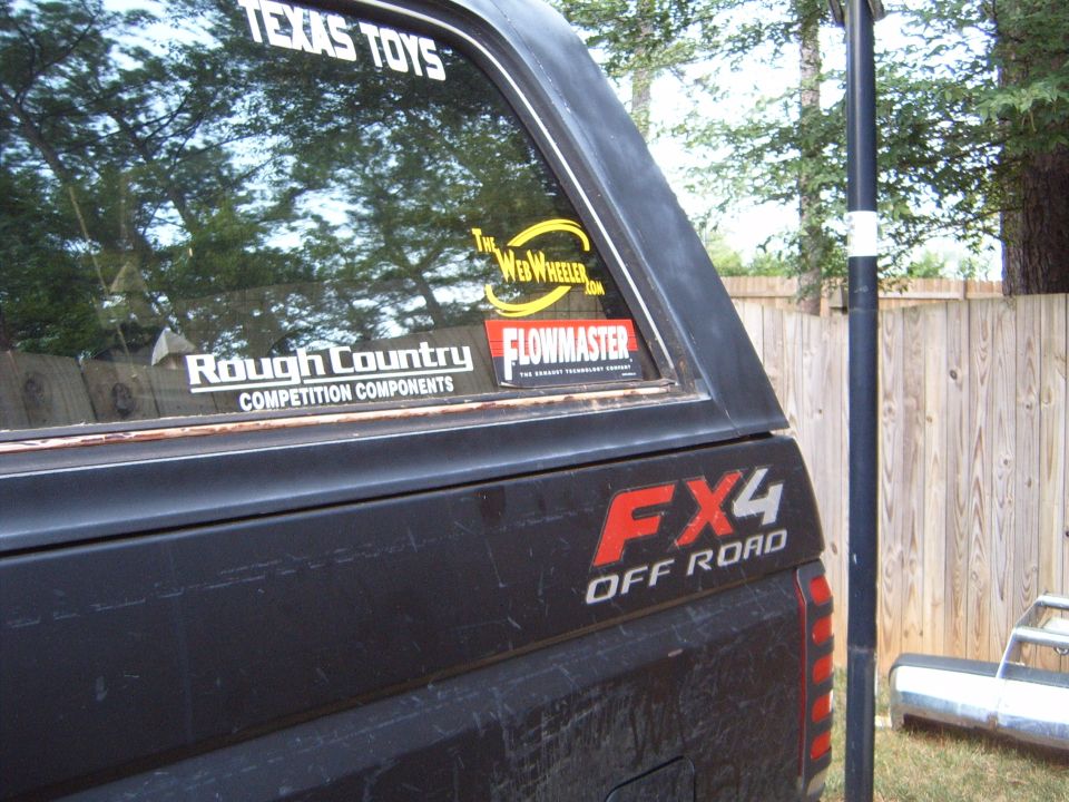Black 1988 Ford Bronco rear quarter panel with FX4 OFF ROAD decal and stickers on the window
