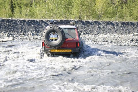 2003 Jeep TJ - 2003 Jeep TJ navigates a shallow river crossing.